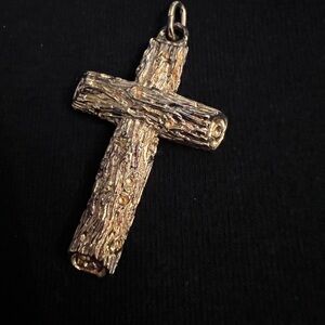 Tree bark, log cut styling on a gold plated sterling Crucifix